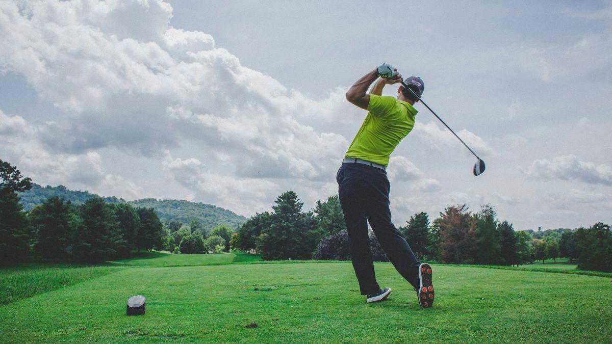 Photo of a man playing golf.